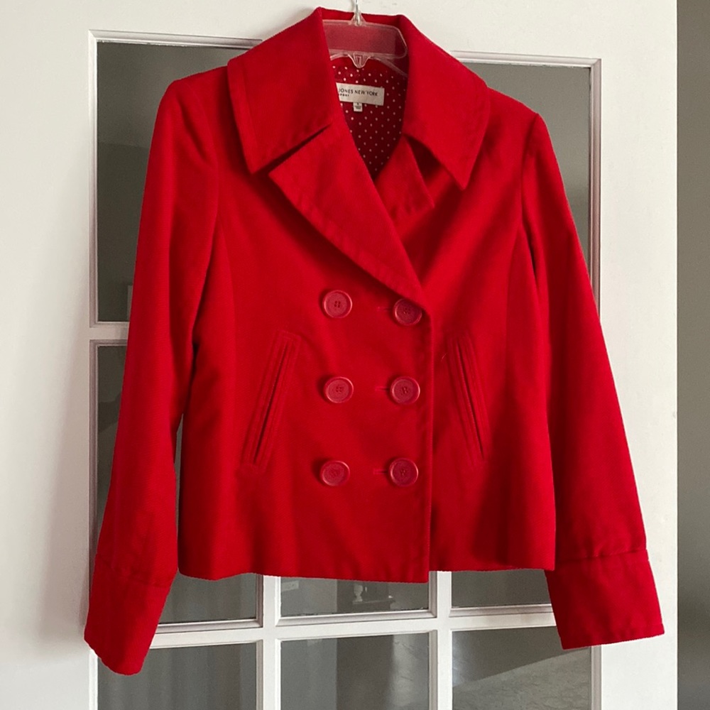 Top woman’s red jacket